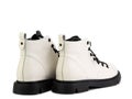 White leather ankle boots with black laces and black rubber sole. Isolated close-up on white background. Back side view Royalty Free Stock Photo