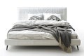 White Leather Bed With Pillows And Blanket On An Isolated White Background Royalty Free Stock Photo