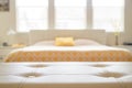 White leather empty bench in front of blurred bedroom Royalty Free Stock Photo