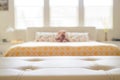 White leather empty bench in front of blurred bedroom Royalty Free Stock Photo