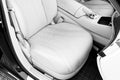 White leather interior of the luxury modern car. Leather comfortable white seats and multimedia. Steering wheel and dashboard. aut Royalty Free Stock Photo