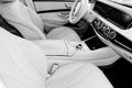 White leather interior of the luxury modern car. Leather comfortable white seats and multimedia. Steering wheel and dashboard. Aut Royalty Free Stock Photo