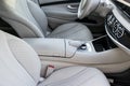 White leather interior of the luxury modern car. Leather comfortable white seats and multimedia. Steering wheel and dashboard. Royalty Free Stock Photo