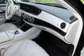 White leather interior of the luxury modern car. Leather comfortable white seats and multimedia. Steering wheel and dashboard. Royalty Free Stock Photo