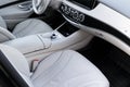 White leather interior of the luxury modern car. Leather comfortable white seats and multimedia. Steering wheel and dashboard. Royalty Free Stock Photo