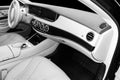 White leather interior of the luxury modern car. Leather comfortable white seats and multimedia. Steering wheel and dashboard. Aut Royalty Free Stock Photo