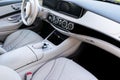 White leather interior of the luxury modern car. Leather comfortable white seats and multimedia. Steering wheel and dashboard. Royalty Free Stock Photo