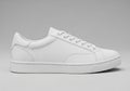 White leather sneaker with minimalistic design, featuring a low-top profile. The shoe has clean Royalty Free Stock Photo