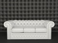 White leather sofa on a black background