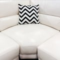 White leather sofa with decorative cushion Royalty Free Stock Photo