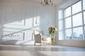 White leather vintage style chair in classical interior room with big window and spring flowers Royalty Free Stock Photo