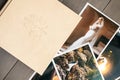 White leather wedding album and printed photos with the bride and groom