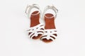 White leather women`s sandals with low heels Royalty Free Stock Photo