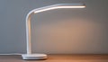 White LED Desk Lamp with Rounded Base and Light Strip Royalty Free Stock Photo