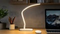 White LED Desk Lamp with Rounded Base and Light Strip Royalty Free Stock Photo