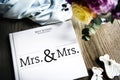 White Lesbian Wedding Guest Book Laid on Wooden Table