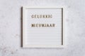 A white letterboard with Gelukkig Nieuwjaar (Dutch for Happy New Year Royalty Free Stock Photo