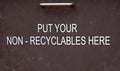Notice on metal bin to place non-recyclable items here
