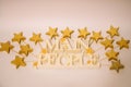 White letters with golden stars on a light and blue background. extruded polystyrene decor.blank for decoration, logo making .