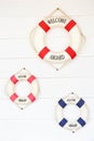 White Life buoy with welcome aboard on white wall Royalty Free Stock Photo