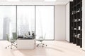 White and light beige panoramic manager office with green rolling chairs