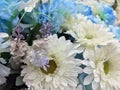 White and light blue color of Flower bouquet, all of it made from fabric.