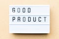 White lightbox with word good product on wood background Royalty Free Stock Photo