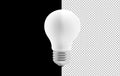White Light Bulb Centered Against Split Black and Transparent Background Representing Energy Concept Royalty Free Stock Photo