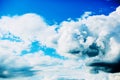 White light cumulus clouds float across the blue sky in the sunny time of the day. Heavenly landscape Royalty Free Stock Photo