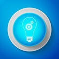 White Light lamp icon isolated on blue background. Bulb with gears and cogs working together symbol. Idea concept Royalty Free Stock Photo