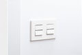 switch and faceplate on white wall Royalty Free Stock Photo