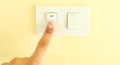 White light switch, finger press on off, the concept of saving electricity, reducing costs Royalty Free Stock Photo