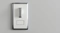 A white light switch with a silver handle. Royalty Free Stock Photo