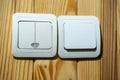 White light switches on wooden wall control electricity Royalty Free Stock Photo