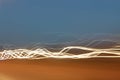 White light trails against blue dusk sky Royalty Free Stock Photo