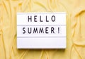 words hello summer on a yellow background