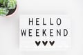 White lightbox with the words hello weekend. Inspirational Quote