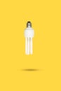 White lightbulb floating on a yellow background