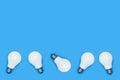 White lightbulbs on a blue background Royalty Free Stock Photo