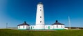 White lighthouse and associated buildings. Nash Point, Vale of Glamorgan, Wales.. Royalty Free Stock Photo