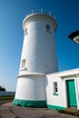 White lighthouse and associated buildings. Nash Point, Vale of Glamorgan, Wales. Royalty Free Stock Photo