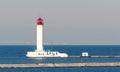 White lighthouse. The blue sea. Waves Royalty Free Stock Photo