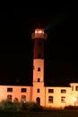 White Lighthouse Building at Night. Royalty Free Stock Photo