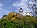 a white lighthouse on the mountain a blue sky day in spring in Guetaria, Basque Country, Spain Royalty Free Stock Photo