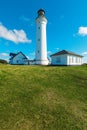 White lighthouse in nature, landscape of Denmark