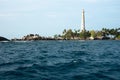 White lighthouse standing on an island in Belitung.