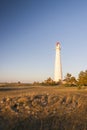 White lighthouse and stone labyrinth Royalty Free Stock Photo