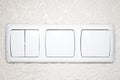 White lighting switchs on concrete wall Royalty Free Stock Photo