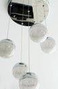 White lightning balls. modern art luxury chandelier made with balls with lamp inside every one. Lighting ball hanging from the Royalty Free Stock Photo