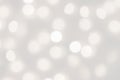 White lights bokeh blurred background, abstract beautiful blurry silver Christmas holiday party texture, copy space Royalty Free Stock Photo
